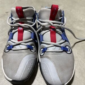 Nike Kids Gray Sneakers with Blue and Red Accents
